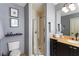 Bright bathroom boasts a walk-in shower and granite countertop vanity at 57 Forsyth Nw St # 5F, Atlanta, GA 30303
