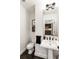 Bright powder room features a pedestal sink and dark tile flooring at 57 Forsyth Nw St # 5F, Atlanta, GA 30303