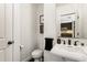 Stylish powder room with elegant pedestal sink and modern fixtures at 57 Forsyth Nw St # 5F, Atlanta, GA 30303