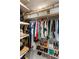 Organized walk-in closet with shelves for shoes and hanging storage for clothes at 57 Forsyth Nw St # 5F, Atlanta, GA 30303