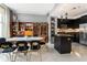 Dining area with a modern table, chairs, and view of the kitchen with an island at 57 Forsyth Nw St # 5F, Atlanta, GA 30303