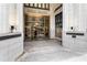 Building entrance featuring glass doors, exterior architecture and stone finishes at 57 Forsyth Nw St # 5F, Atlanta, GA 30303