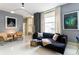 Elegant living room with a plush sofa, stylish lighting, and large windows with natural light at 57 Forsyth Nw St # 5F, Atlanta, GA 30303