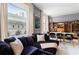 Stylish living room with large windows, plush seating and a dining area at 57 Forsyth Nw St # 5F, Atlanta, GA 30303