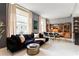 Open-concept living room with a comfortable sofa, dining area, and built-in shelving at 57 Forsyth Nw St # 5F, Atlanta, GA 30303