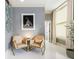 Cozy sitting area featuring two comfortable chairs, a table, and decorative wall art at 57 Forsyth Nw St # 5F, Atlanta, GA 30303