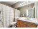 Bathroom features a white vanity, large mirror and shower with white curtain at 951 Glenwood Ave # 801, Atlanta, GA 30316