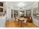 Bright dining room with hardwood floors, bay windows and updated light fixture at 951 Glenwood Ave # 801, Atlanta, GA 30316