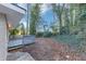 This home features a wooden deck and wooded lot at 1834 Hillsdale Dr, Decatur, GA 30032