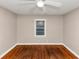 Simple bedroom with hardwood floors, a window, and neutral walls at 1834 Hillsdale Dr, Decatur, GA 30032