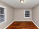 Bedroom featuring hardwood floors and a window for natural light at 1834 Hillsdale Dr, Decatur, GA 30032