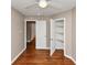 This cozy bedroom includes hardwood floors, a closet, and a ceiling fan at 1834 Hillsdale Dr, Decatur, GA 30032