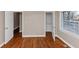 This bedroom features wood floors, a closet, and a window with wood blinds at 1834 Hillsdale Dr, Decatur, GA 30032