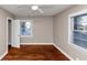 This is a bedroom with hardwood floors, a ceiling fan, and natural light at 1834 Hillsdale Dr, Decatur, GA 30032