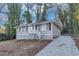 Single Gathering home featuring a cozy front porch and driveway at 1834 Hillsdale Dr, Decatur, GA 30032