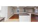 The open-concept kitchen boasts bar seating and seamlessly connects to the living area at 1834 Hillsdale Dr, Decatur, GA 30032