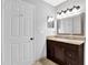 Bathroom featuring a mirror, granite vanity top, and a neutral color scheme at 305 Mill Pond Se Ct, Smyrna, GA 30082