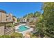 Elevated view of the community pool, showcasing its unique shape and the surrounding residential buildings at 305 Mill Pond Se Ct, Smyrna, GA 30082
