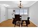A dining area features stylish light fixture and table with chairs at 305 Mill Pond Se Ct, Smyrna, GA 30082