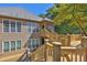 Lovely home showcasing a multi-tiered deck with views of the private backyard at 305 Mill Pond Se Ct, Smyrna, GA 30082