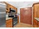 A kitchen with stainless steel appliances and granite countertops at 305 Mill Pond Se Ct, Smyrna, GA 30082