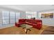 Cozy living room with a sectional sofa, glass coffee table, and hardwood floors at 305 Mill Pond Se Ct, Smyrna, GA 30082