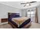 Comfortable main bedroom with a ceiling fan, window, and a neutral color scheme at 305 Mill Pond Se Ct, Smyrna, GA 30082