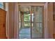View of an outdoor patio with sliding glass doors and a ceiling fan from the home's interior at 305 Mill Pond Se Ct, Smyrna, GA 30082