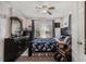 Bedroom with two windows, floral bedding, and dark wood furniture at 850 Third St, Stone Mountain, GA 30083