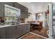 An eat-in kitchen includes lots of cabinets, an eating space, and white appliances at 850 Third St, Stone Mountain, GA 30083