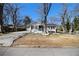 Charming one-story home with a long driveway, and a small front porch with seating at 850 Third St, Stone Mountain, GA 30083
