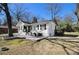 Charming home with brick facade, featuring a cozy front porch and an outdoor seating area at 850 Third St, Stone Mountain, GA 30083