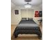 Attic bedroom with modern lighting, window with shades, and accent wall decorations at 3320 Donegal Way, Snellville, GA 30039