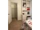 A cozy bedroom features a built-in desk with shelving and a walk-in closet for ample storage at 3320 Donegal Way, Snellville, GA 30039