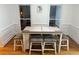 Cozy dining area with modern table and chairs, showcasing ample natural light and stylish design at 3320 Donegal Way, Snellville, GA 30039