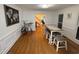 Spacious dining room features hardwood floors, modern furnishings, and abundant natural light at 3320 Donegal Way, Snellville, GA 30039