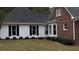 Charming home with a combination of brick and siding, complemented by well-maintained landscaping at 3320 Donegal Way, Snellville, GA 30039