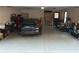 Spacious two car garage with a black sports car and plenty of storage at 3320 Donegal Way, Snellville, GA 30039