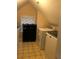 Laundry room features linoleum floors, a washer and dryer and a shoe rack at 3320 Donegal Way, Snellville, GA 30039