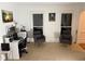Office space includes golf decor, comfortable seating, and natural light from two windows at 3320 Donegal Way, Snellville, GA 30039