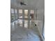 Bright sunroom with marble floors, multiple windows, and a door leading to the deck at 3320 Donegal Way, Snellville, GA 30039