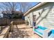 Backyard features a spacious wooden deck with blue outdoor sofa and stainless steel grill at 1816 Williams Ave, East Point, GA 30344