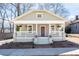 Charming craftsman home with a welcoming front porch, landscaped yard and painted in a pleasing color scheme at 1816 Williams Ave, East Point, GA 30344