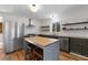 Modern kitchen with a center island, stainless steel appliances, and ample counter space, ideal for culinary enthusiasts at 1816 Williams Ave, East Point, GA 30344