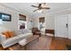 Cozy living room featuring hardwood floors, a ceiling fan, and neutral-toned walls, creating a warm and inviting atmosphere at 1816 Williams Ave, East Point, GA 30344