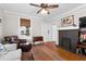 Bright living room with a fireplace, hardwood floors, and traditional details at 1816 Williams Ave, East Point, GA 30344