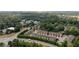 Beautiful aerial view of the townhome community and surrounding green spaces, with nearby roadways for easy commuting at 2289 Emerald Sky Dr, Smyrna, GA 30080