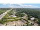 Aerial view of the townhome community surrounded by lush greenery and easy access to the highway and local amenities at 2289 Emerald Sky Dr, Smyrna, GA 30080