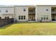Spacious backyard with green lawn, patio and black metal dining set with grill, perfect for entertaining at 2289 Emerald Sky Dr, Smyrna, GA 30080