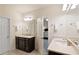 Spacious bathroom featuring dual sinks, a vanity with drawers, and access to the bedroom at 2289 Emerald Sky Dr, Smyrna, GA 30080